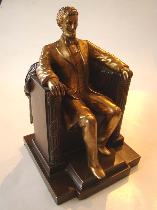 A single "Lincoln in the chair" two-tone bookend by Jennings Brothers circa 1930
